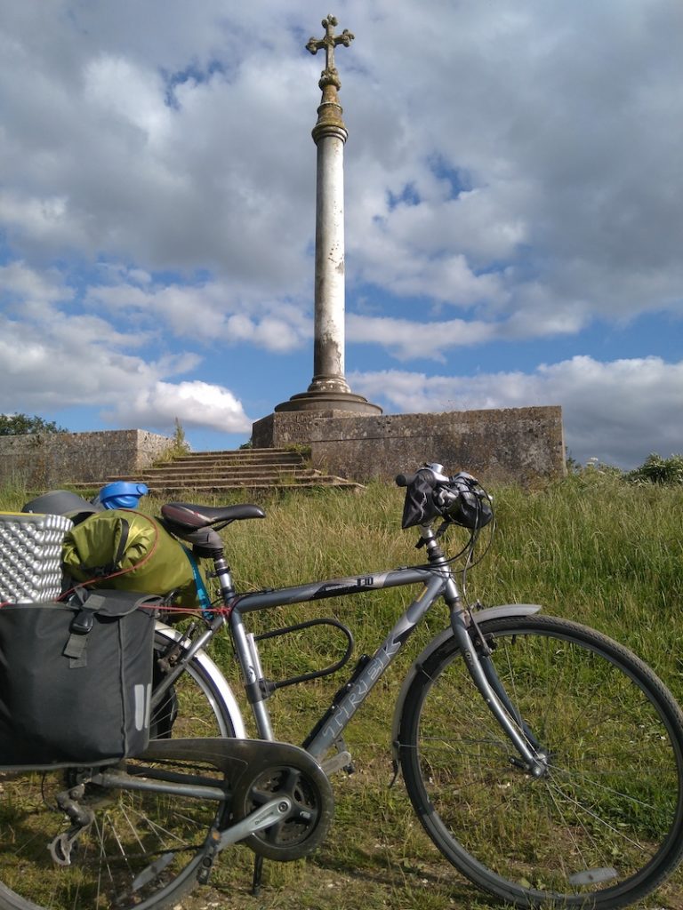Bike with heavy baggage, memorial in background
